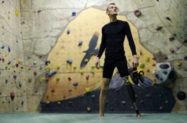 veteran in front of rock wall