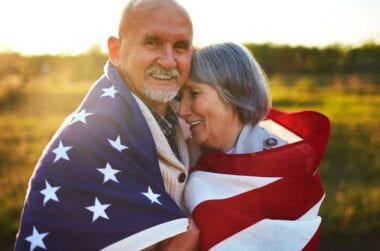 couple wrapped in u.s. flag